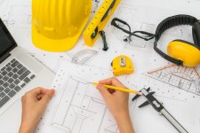 hand-construction-plans-with-yellow-helmet-drawing-tool (1) (2) (1).jpg